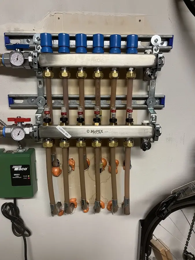 Plumber performing Water Heater Repair at a residential property in Paris