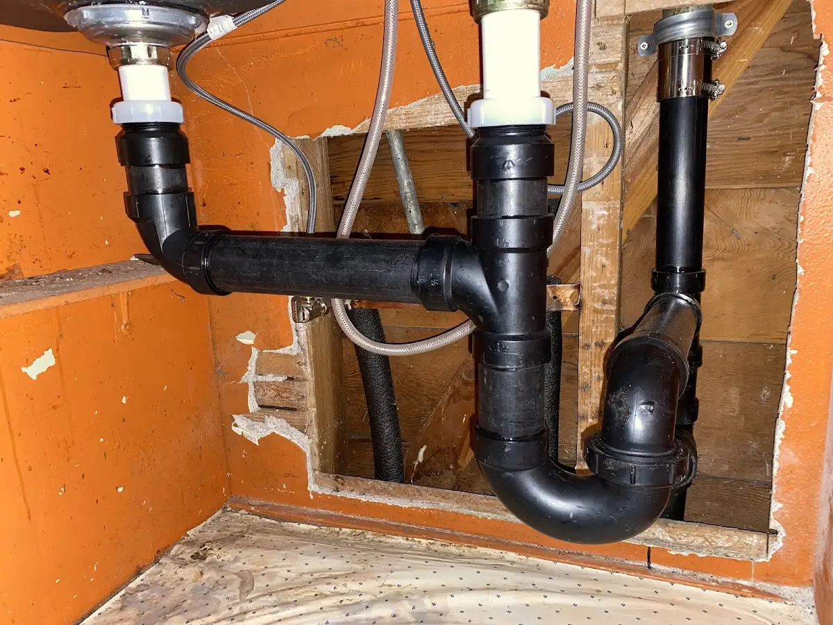 Professional Garbage Disposal Repair equipment and tools on the job in Paris